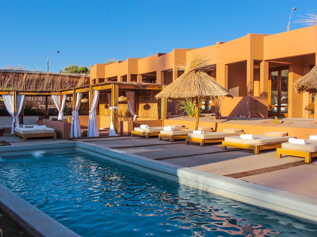 Clique na foto e faça sua reserva no Noi Casa, hotel no Deserto de San Pedro de Atacama, no Chile.